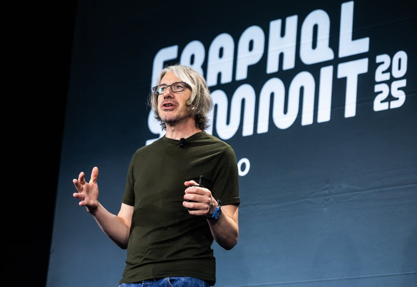 Speaker on stage at the conference.